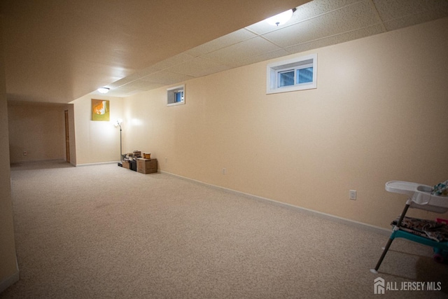 basement featuring carpet flooring