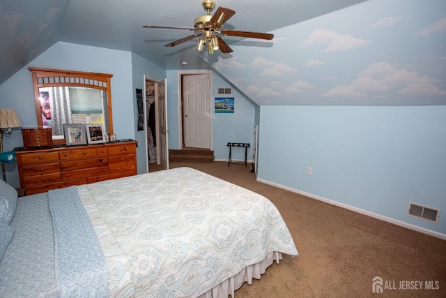 bedroom with lofted ceiling, carpet floors, a closet, and ceiling fan