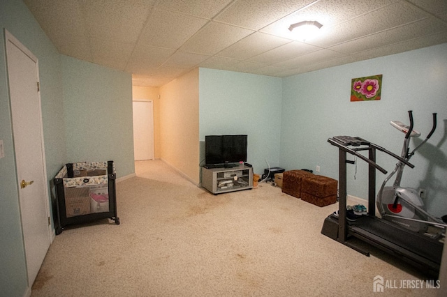 exercise room with light colored carpet