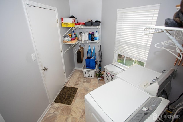 clothes washing area with washer and dryer