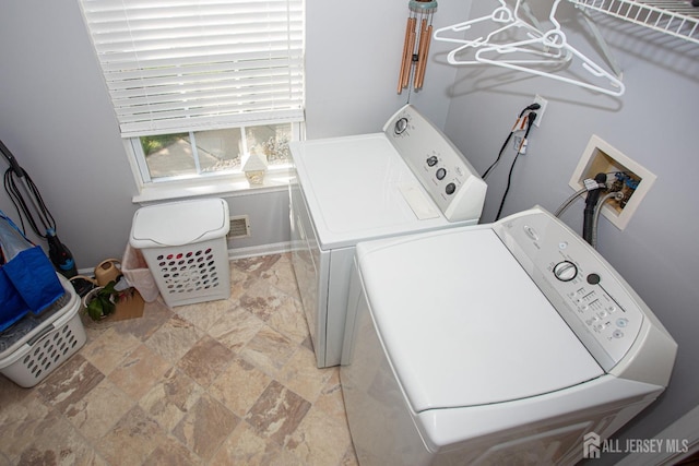 laundry room with washer and clothes dryer