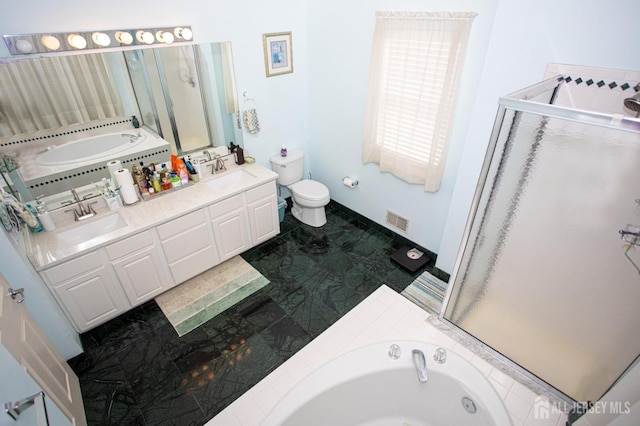 full bathroom with toilet, vanity, and separate shower and tub