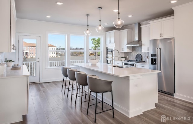 302 Nash Ave, West Windsor, NJ 08550 - kitchen featuring plenty of natural light, ornamental molding, stainless steel appliances, and wall chimney exhaust hood