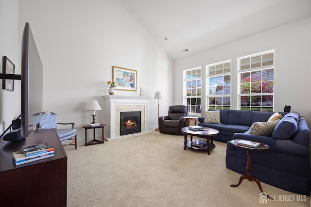 1 Jester Ct, Monroe, NJ 08831 - living area featuring high vaulted ceiling, light carpet, a glass covered fireplace, and baseboards
