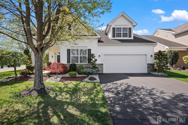 1 Jester Ct, Monroe, NJ 08831 - view of front of home featuring asphalt driveway, stone siding, and a front yard