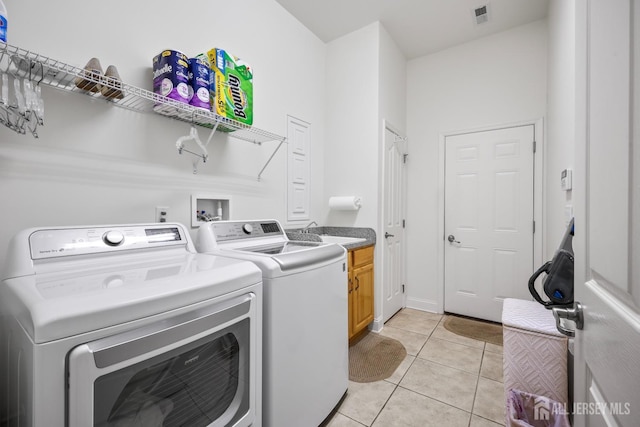 1 Jester Ct, Monroe, NJ 08831 - laundry area featuring washing machine and dryer, cabinet space, and light tile patterned floors