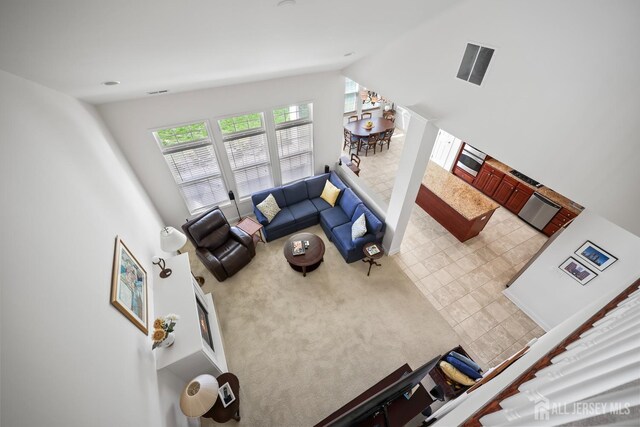 1 Jester Ct, Monroe, NJ 08831 - living room with vaulted ceiling and carpet flooring