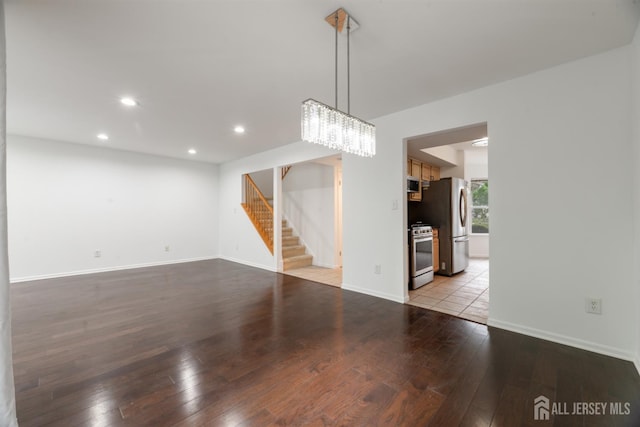 44 Treat Ln, East Brunswick, NJ 08816 - unfurnished living room featuring stairs, light wood-style flooring, recessed lighting, and a chandelier