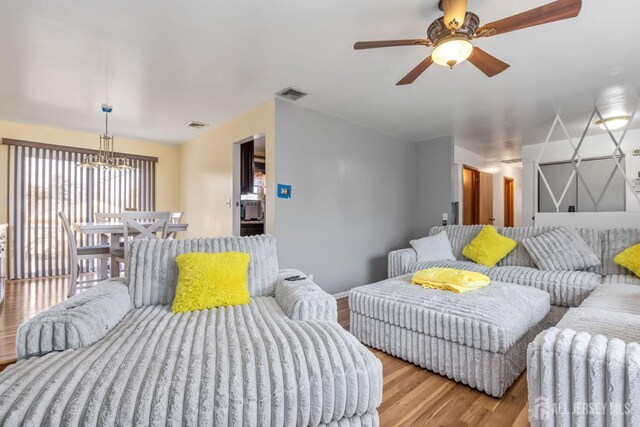 bedroom with ceiling fan and light hardwood / wood-style floors