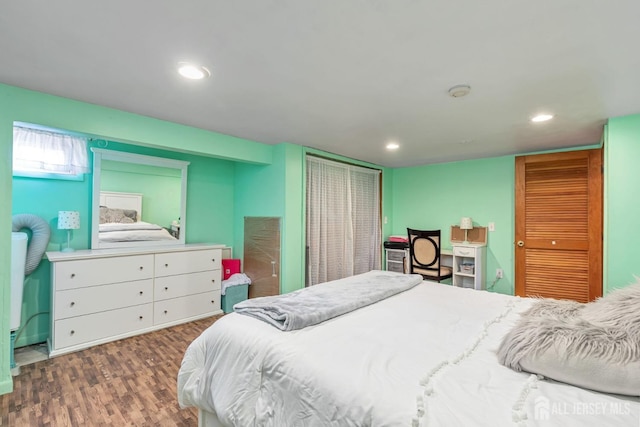 bedroom featuring dark hardwood / wood-style flooring