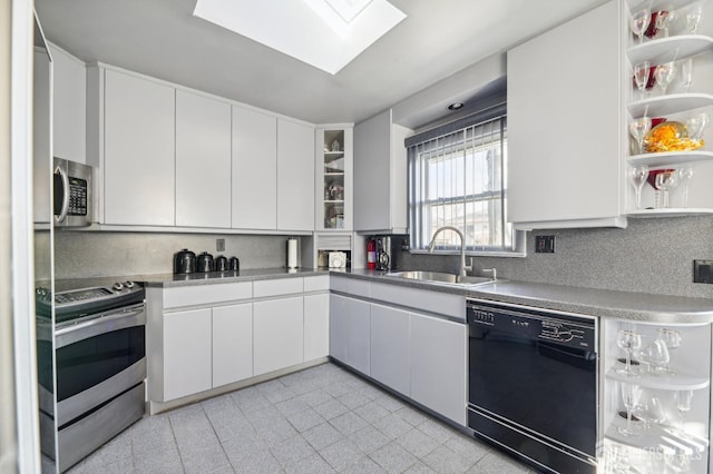 kitchen with stainless steel appliances, open shelves, a sink, and white cabinets