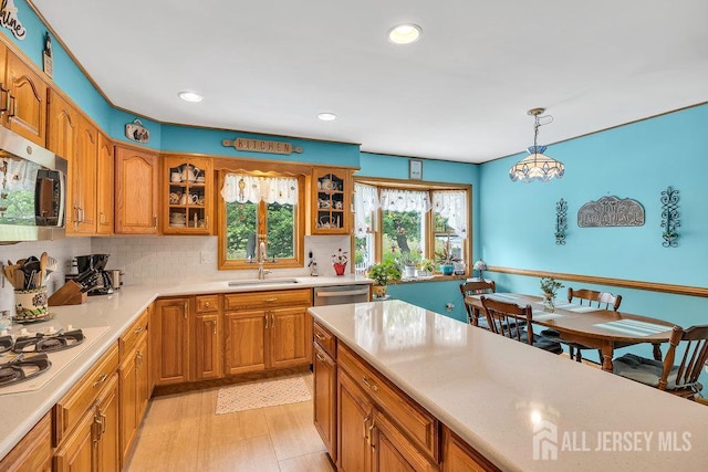 4 Anne Ter, South Amboy, NJ 08879 - kitchen with appliances with stainless steel finishes, brown cabinets, decorative backsplash, and recessed lighting
