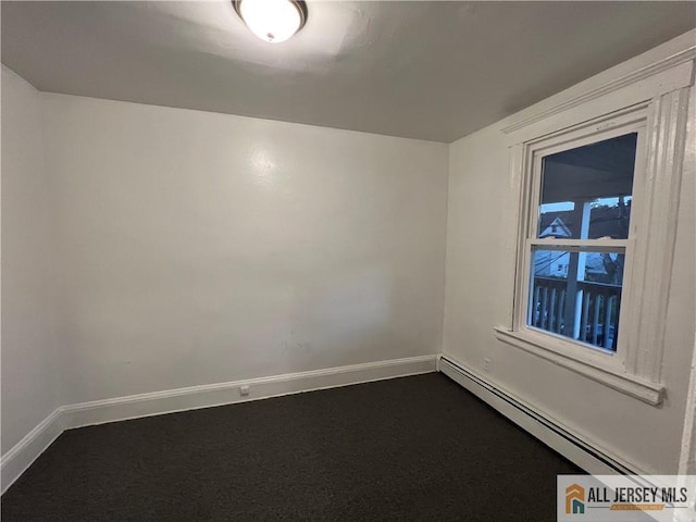 425 John St, Plainfield, NJ 07060 - spare room with baseboard heating, baseboards, and dark carpet