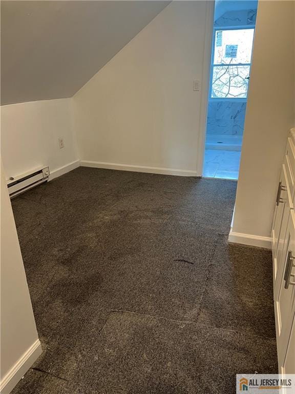 425 John St, Plainfield, NJ 07060 - bonus room featuring a baseboard radiator, vaulted ceiling, baseboards, and dark colored carpet