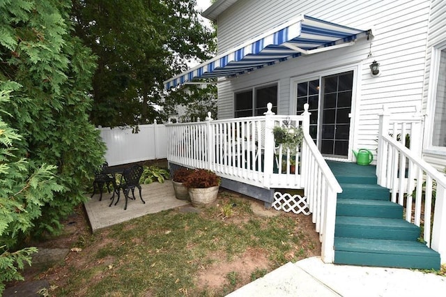 deck featuring a patio and fence