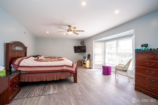 bedroom with visible vents, recessed lighting, a ceiling fan, and wood finished floors