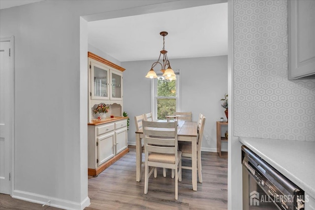 218 Winthrop Ave, Moorestown, NJ 08057 - dining space with a chandelier, wood finished floors, baseboards, and beverage cooler