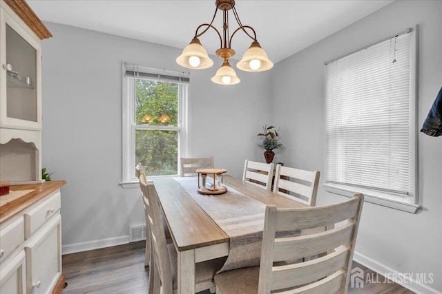 218 Winthrop Ave, Moorestown, NJ 08057 - dining room featuring dark wood-style floors, baseboards, and a chandelier