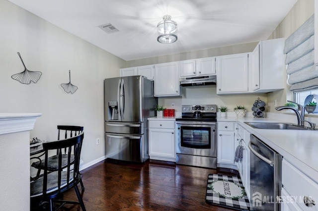 kitchen with sink, white cabinets, and appliances with stainless steel finishes