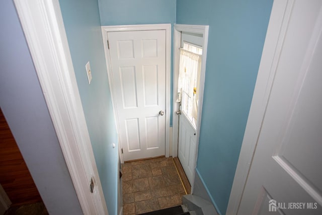 25 S Edward St S, Sayreville, NJ 08872 - doorway to outside featuring stone finish floors and baseboards