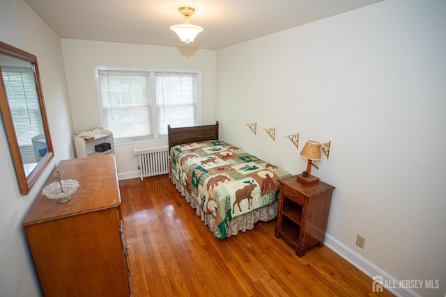 25 S Edward St S, Sayreville, NJ 08872 - bedroom with radiator, wood finished floors, and baseboards
