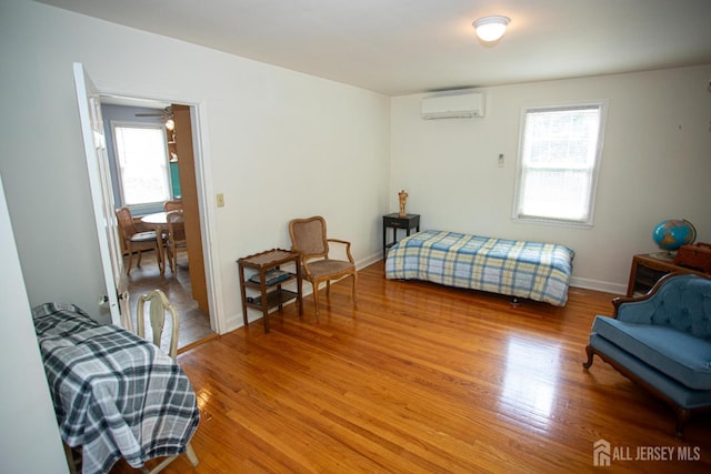 25 S Edward St S, Sayreville, NJ 08872 - bedroom featuring a wall unit AC, light wood-style floors, and baseboards