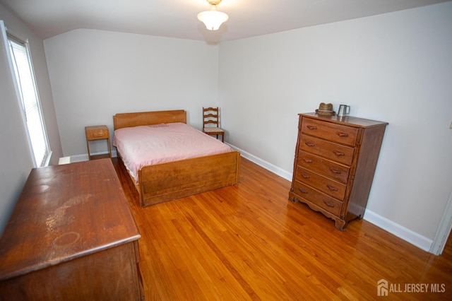 25 S Edward St S, Sayreville, NJ 08872 - bedroom with light wood-type flooring, lofted ceiling, and baseboards