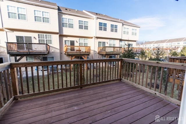 wooden deck with a residential view