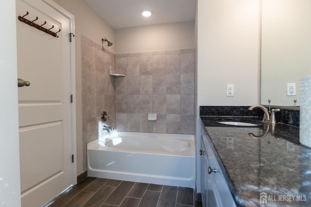 full bath with vanity, shower / bathtub combination, and wood finish floors
