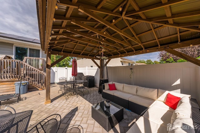 view of patio with a gazebo and outdoor lounge area