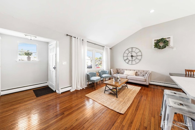 living area featuring a baseboard heating unit, vaulted ceiling, a baseboard radiator, and dark wood-style floors