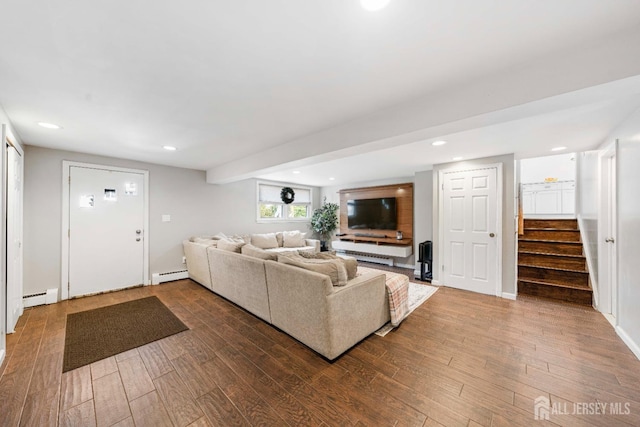 living room with hardwood / wood-style flooring and a baseboard radiator