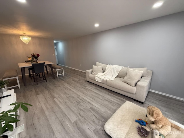 104 Morgan Pl E, Brunswick, NJ 08816 - living room featuring wood finished floors, a chandelier, recessed lighting, and baseboards