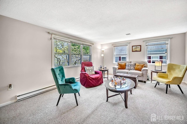 carpeted living room with a baseboard radiator, a baseboard heating unit, and a textured ceiling