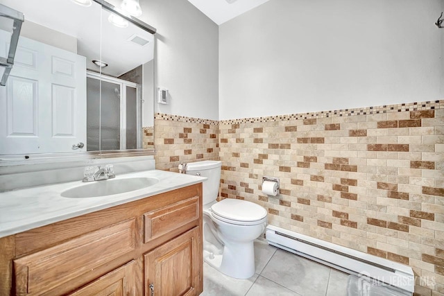 bathroom with toilet, tile walls, tile patterned floors, a shower stall, and a baseboard radiator
