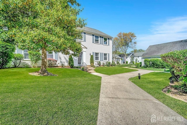 colonial inspired home with a front yard