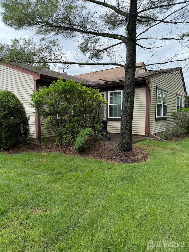 145 Concordia Cir Unit A, Monroe, NJ 08831 - view of property exterior featuring a lawn