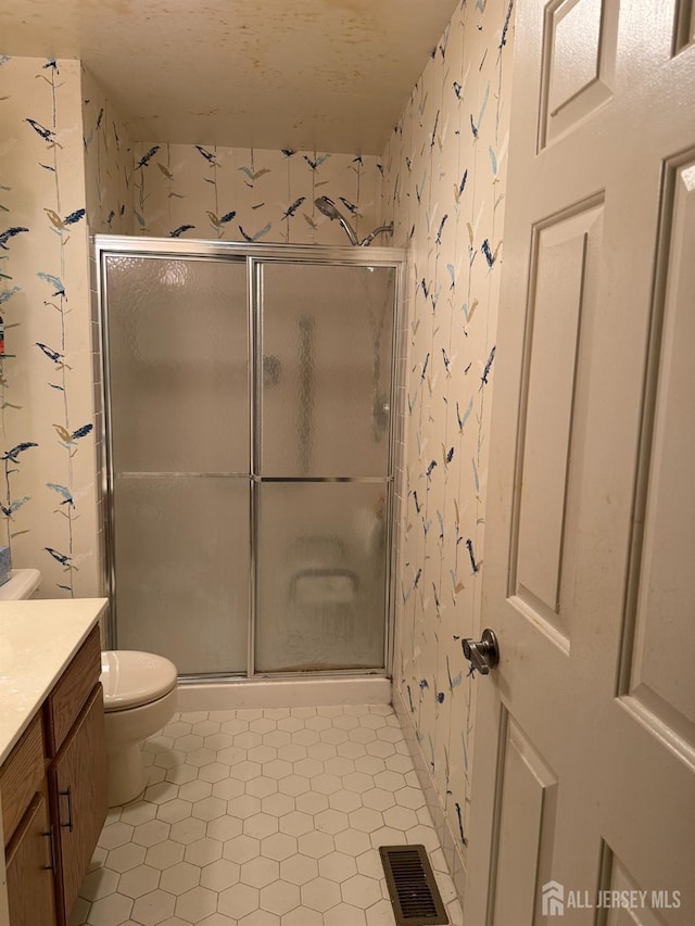 145 Concordia Cir Unit A, Monroe, NJ 08831 - full bathroom with vanity, a stall shower, toilet, and wallpapered walls