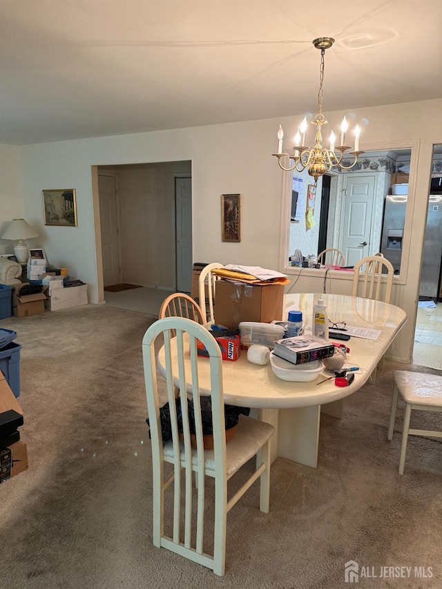 145 Concordia Cir Unit A, Monroe, NJ 08831 - dining space featuring a chandelier and carpet