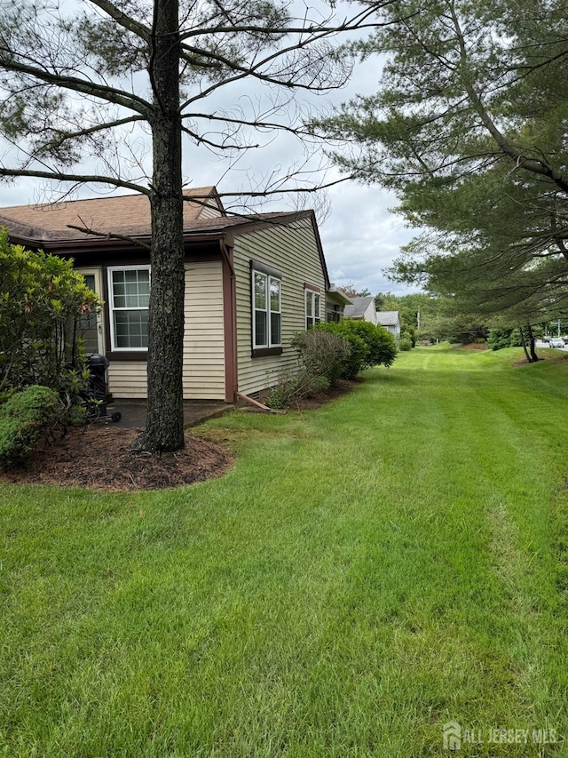 145 Concordia Cir Unit A, Monroe, NJ 08831 - view of home's exterior with a yard