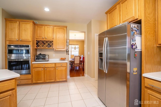 4 Cottonwood Ct, Plainsboro, NJ 08536 - kitchen featuring stainless steel appliances, light countertops, brown cabinets, and recessed lighting
