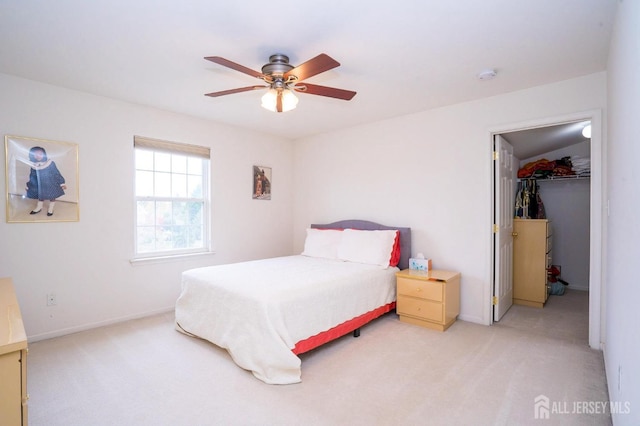 4 Cottonwood Ct, Plainsboro, NJ 08536 - bedroom with light carpet, a walk in closet, baseboards, a ceiling fan, and a closet