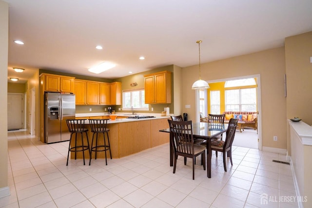 4 Cottonwood Ct, Plainsboro, NJ 08536 - kitchen with stainless steel refrigerator with ice dispenser, light countertops, light tile patterned flooring, pendant lighting, and recessed lighting
