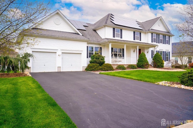 4 Cottonwood Ct, Plainsboro, NJ 08536 - view of front of home with a porch, a front yard, asphalt driveway, and a garage