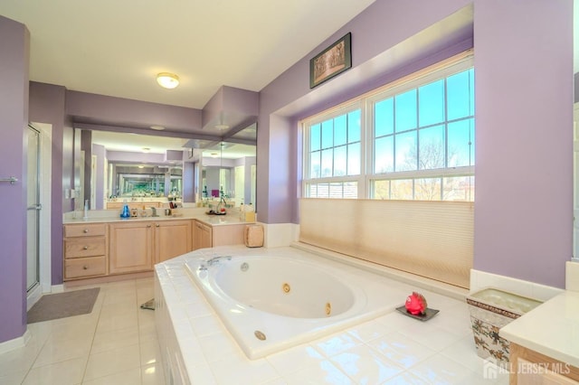 4 Cottonwood Ct, Plainsboro, NJ 08536 - bathroom with a tub with jets, vanity, a shower stall, tile patterned floors, and baseboards