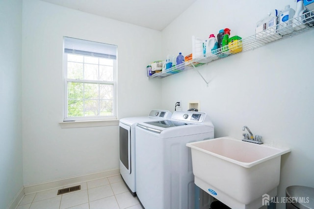 4 Cottonwood Ct, Plainsboro, NJ 08536 - laundry room with washing machine and clothes dryer, baseboards, and light tile patterned flooring