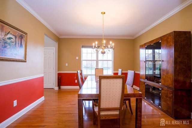 4 Cottonwood Ct, Plainsboro, NJ 08536 - dining space with a chandelier, wood finished floors, baseboards, and crown molding