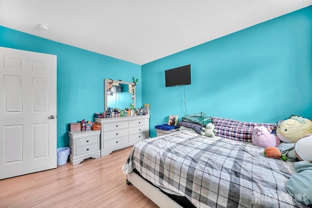 bedroom with light wood-type flooring