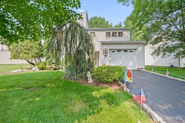 236 Community Cir, Old Bridge, NJ 08857 - view of front of property with driveway, a garage, and a front yard