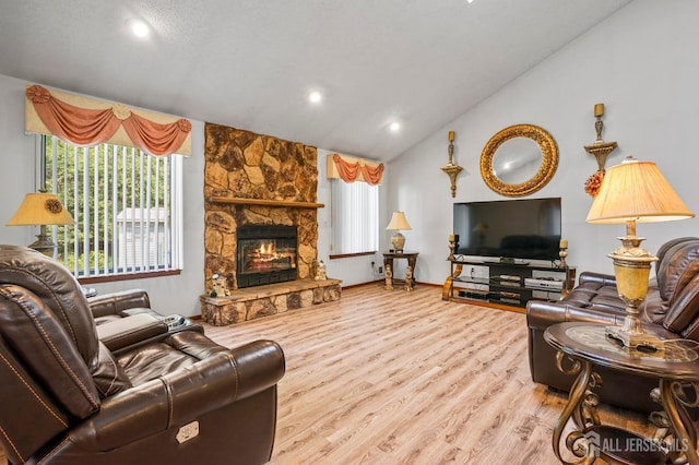 236 Community Cir, Old Bridge, NJ 08857 - living area featuring lofted ceiling, wood finished floors, recessed lighting, and a stone fireplace